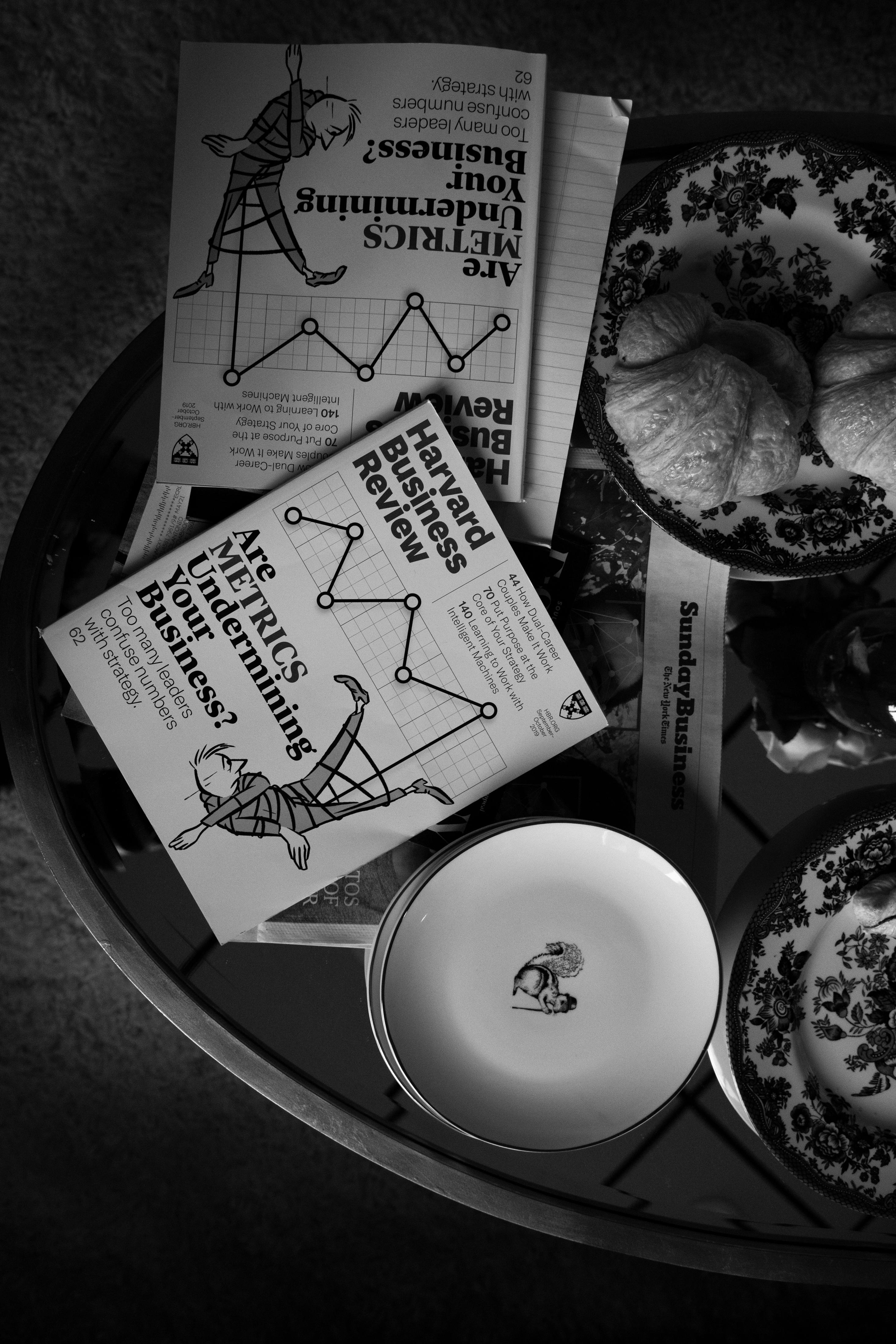 Review Club promo image - two HBR magazines next two each other in black and white on a table. 